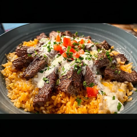 A plate of meat and rice.